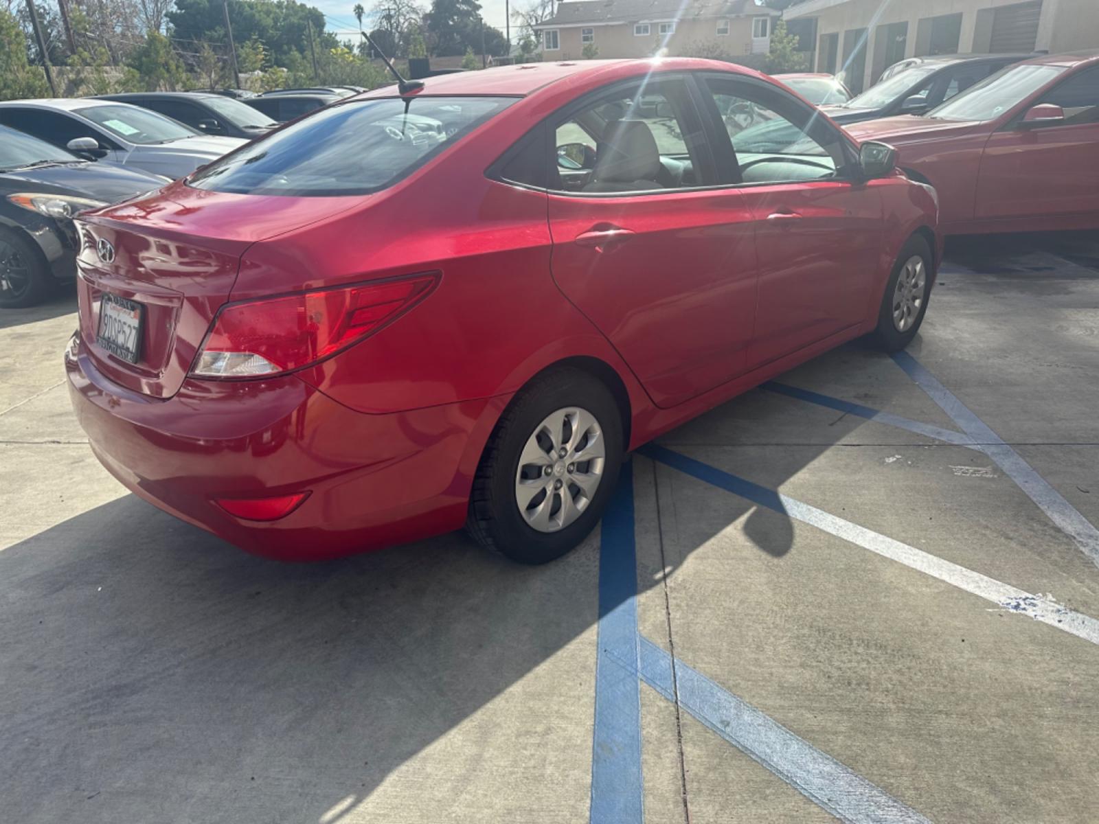 2015 Red /Gray Hyundai Accent GLS Sedan 4D (KMHCT4AE2FU) with an 4-Cyl, 1.6L engine, Auto, 6-Spd w/Overdrive transmission, located at 30 S. Berkeley Avenue, Pasadena, CA, 91107, (626) 248-7567, 34.145447, -118.109398 - The 2015 Hyundai Accent 4-Door Sedan stands as a testament to Hyundai's commitment to quality, efficiency, and value. Located in Pasadena, CA, our dealership specializes in providing a wide range of used BHPH (Buy Here Pay Here) cars, trucks, SUVs, and vans, including the remarkable Hyundai Accent. - Photo #5